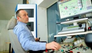 stockphotoscom-7544683 man typing at factory computer-small