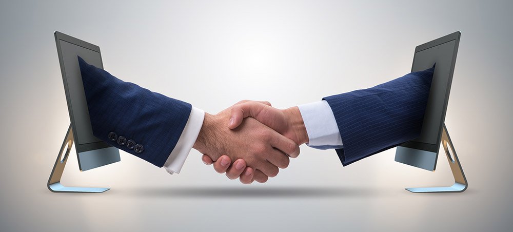 stockphotoscom-6336605 _ Two hands from screen in handshake concept - Small